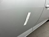 the door handle of a car with a sticker on it