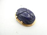 an image of a blue stone scart sitting on top of a white surface