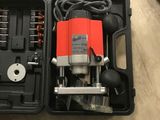 a box with tools in it on a wooden floor