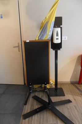 an umbrella sitting on top of a stand in a room