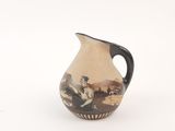 a small vase with a painting on it on a white surface