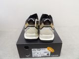men ' s shoes in a box on a white surface