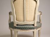 an image of a chair with a green seat and a white back