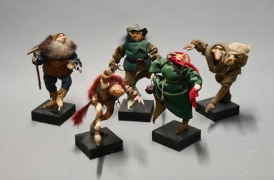 five figurines of different characters on display