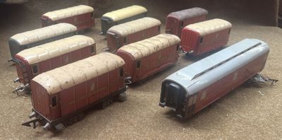 several toy trains are lined up on the floor next to each other