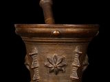 a mortar with a pestula in it on a black background