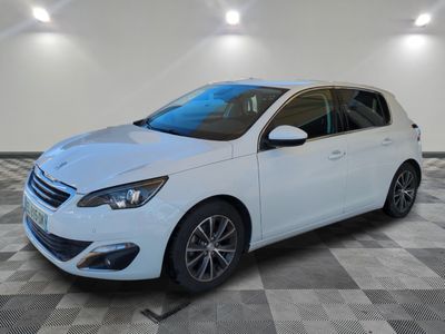 a white car is parked in a room with a checkered floor