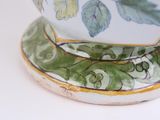 a close up of a bowl on a white surface