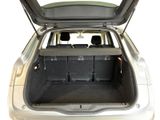 the back of a car with the trunk open and the seats down