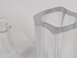 a glass vase and a glass vase on a table