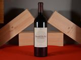 a bottle of wine that is sitting on a table