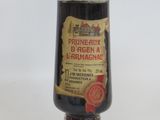 a bottle with a label on it sitting on a table
