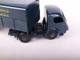 a toy truck that is sitting on a white surface