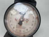 a close up of a clock with a face on it