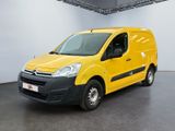 the yellow van is parked in a large white room