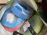 a bag full of different colored wires in it