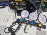 a picture of a couple of gauges and a compressor