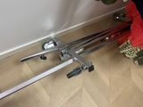 a pair of skis sitting on the floor next to a pair of skis