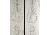 pair of antique silver painted wall panels with musical instruments on them