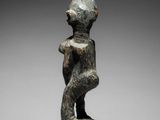 an image of a statue of a man with a hat on his head