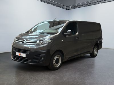 the van is parked in the large room of the building