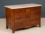 a marble top chest of drawers on a wooden stand