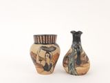 two vases that are sitting next to each other