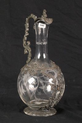 a glass vase with a handle on a black background
