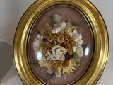 a picture of a picture of flowers in a gold frame