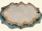 a picture of a plate with a flower decoration on it