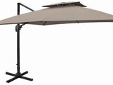 an umbrella with a black base and a beige canopy