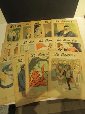 beaucoup de vieilles bandes dessinées françaises posées sur une table