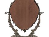 an antique mirror with a wooden frame and a metal stand