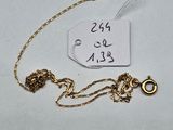 a close up of a gold chain with a tag on it
