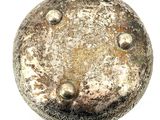 a silver object that is sitting on a white surface
