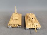 two toy tanks sitting side by side on a table