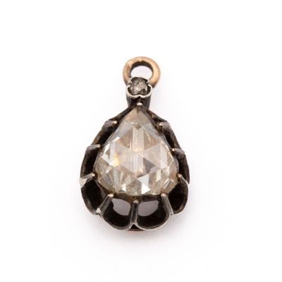 a close up of a diamond pendant on a white background