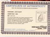 a certificate that is on the table next to a cup of coffee