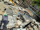 a pile of rubble and a bottle of water on top of it
