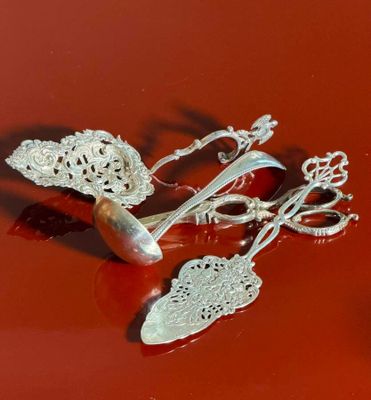a pair of scissors and a pair of scissors on a red surface