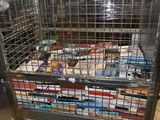 a large metal cage filled with books in a warehouse