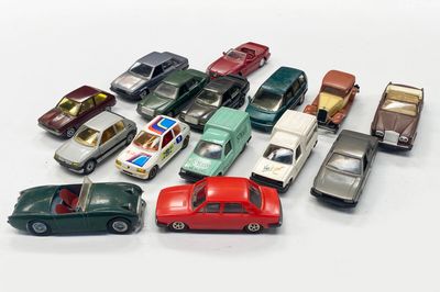 a lot of toy cars that are sitting on a table