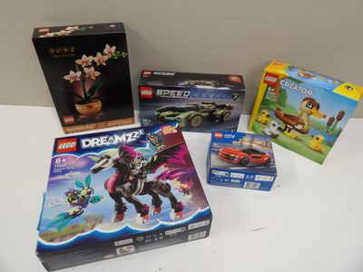 many legos and other toys sitting on a table