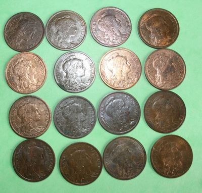 a lot of coins that are on a green surface