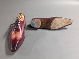 a pair of shoes sitting on top of a table next to each other