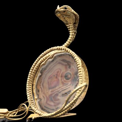 an image of a gold and agate pendant with a snake on it
