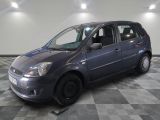a picture of a small car parked in a garage