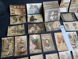 a lot of old postcards sitting on a table