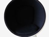a black chair with a white base and a black cushion