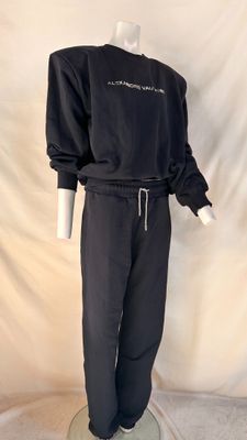 the mannequin is wearing a black sweatshirt and pants